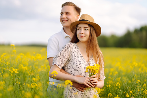 Young Couple in the blooming field