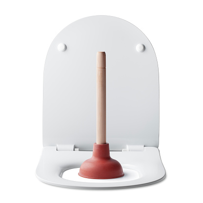 Plunger on the toilet bowl isolated on white background. Photo with clipping path.