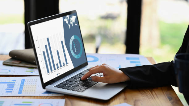 istock Closeup view female worker analyzing financial data and planning marketing strategy at office desk. 1499139932