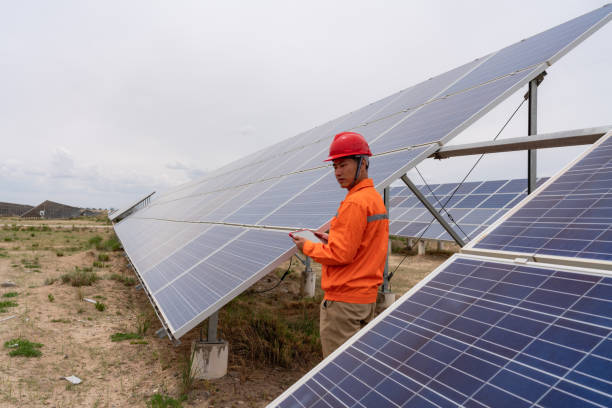 istock Asian male engineer using tablet computer in solar power plant 1499141513