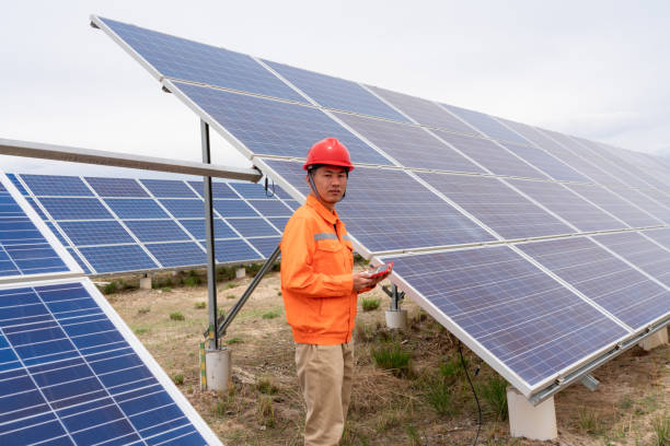 istock Asian male engineer using tablet computer in solar power plant 1499141531