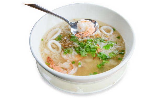 istock Top view of boiled rice soup with shrimps and squid, focus selective 1499145469