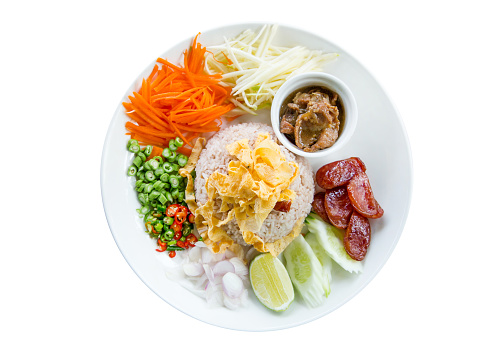 Die cut of Thai food Rice Seasoned with Shrimp Paste Recipe In Black Plate on white isolated.