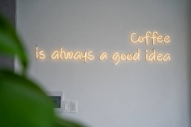 istock A yellow neon sign on white wall at coffee shop. 1499150398