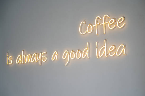 istock A yellow neon sign on white wall at coffee shop. 1499150403
