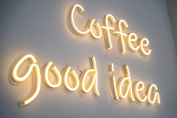 istock A yellow neon sign on white wall at coffee shop. 1499150887