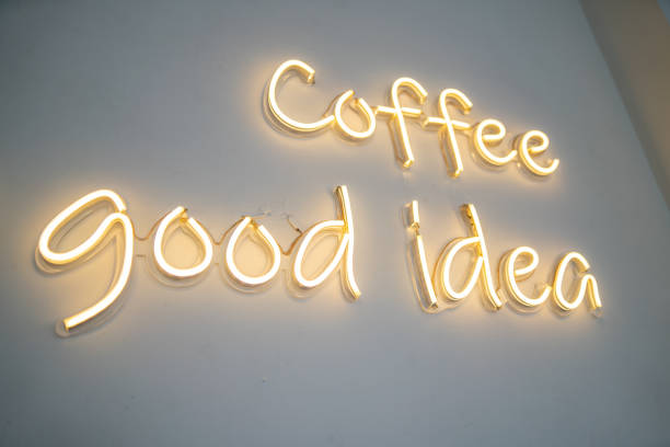 istock A yellow neon sign on white wall at coffee shop. 1499150942