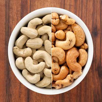 Composite of raw and roasted cashews in white bowl for contrast concept