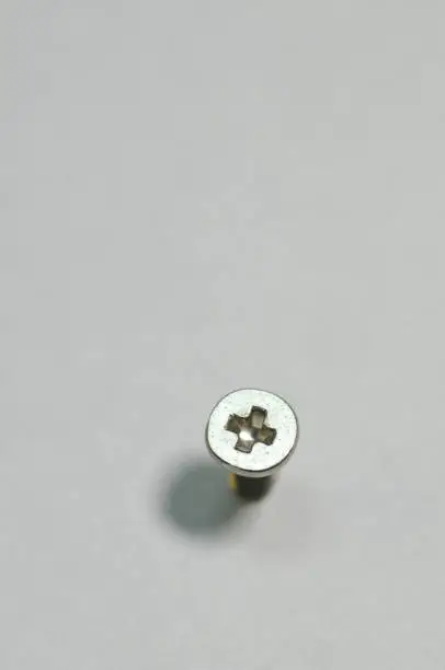 Photo of A small screw that is inserted into the wall to hang things