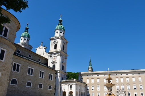 Salzburg cathedral from Residenzplatz with Residenzbrunnen fountain in Salzburg city centre in Austria