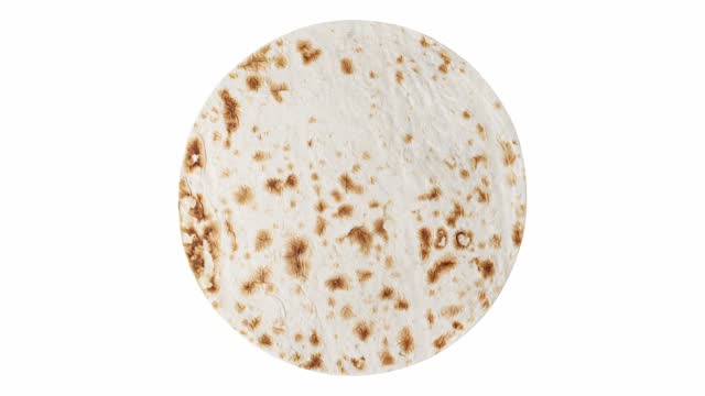 Pita tortilla round, rotating on white background, turning, top view