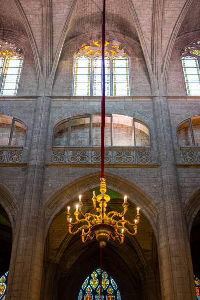 An axial photo of one of the chandeliers inside the Auch St. Mary Cathedral with no people