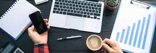 istock man hand coffee with phone 1499168205