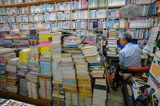 Busan, South Korea - May 26, 2023: A book seller on Bosu-dong Book Street, it is a famous book selling street in Busan, South Korea.