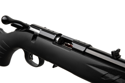 Small-bore bolt rifle in a plastic stock of .22lr. Small rifled weapon for hunting and sports. Isolate on a white background.