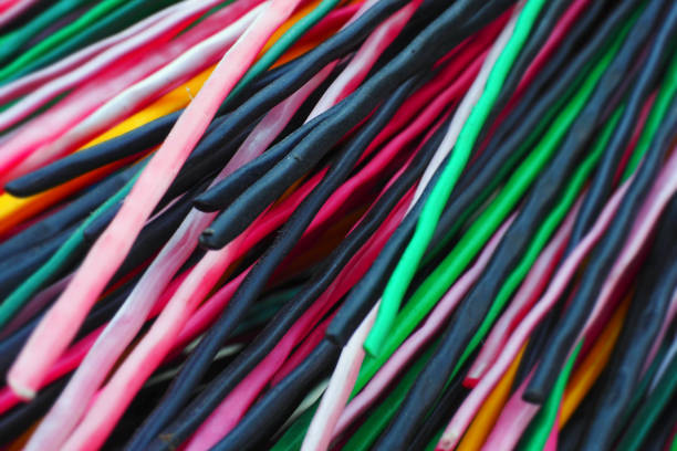 istock Multi-colored plastic rods for recycling and recyclables. Background in full screen 1499173495