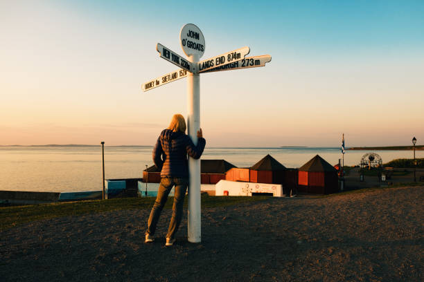 istock John o’Groats sign post, Scotland, at sunset in June 1499175046