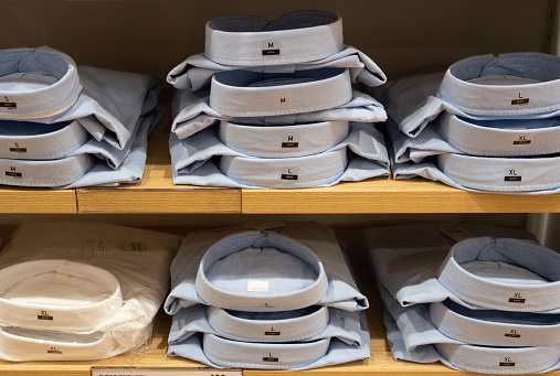 Men's Shirt Stacked Neatly Placed on Shelves