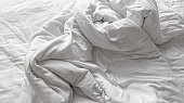 Close-up View of Disheveled and Wrinkled White Soft Linen Blanket