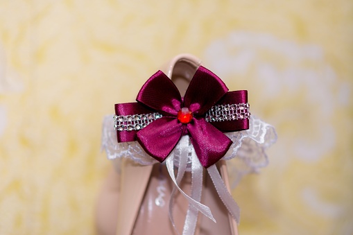 Wedding shoes of the bride with a bow.