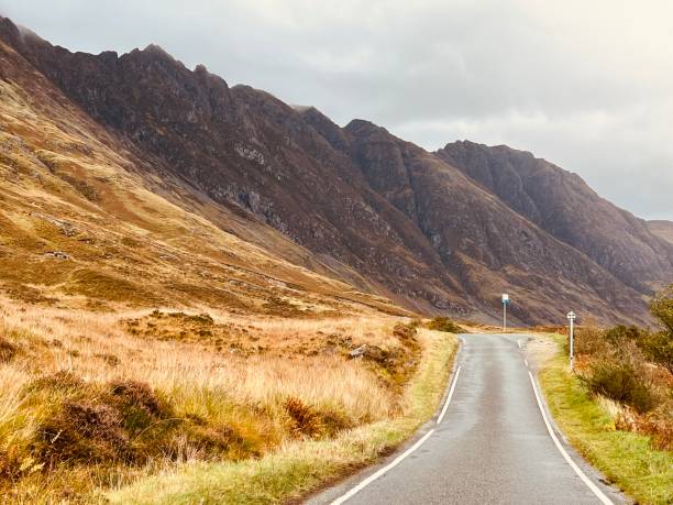 istock Empty mountain road in Glencoe in Scotland 1499179716