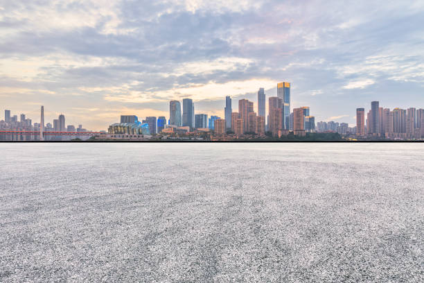 istock Empty asphalt road and city buildings skyline 1499184143