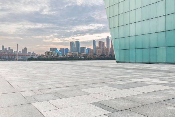 istock Empty square pavement and city buildings skyline 1499184236