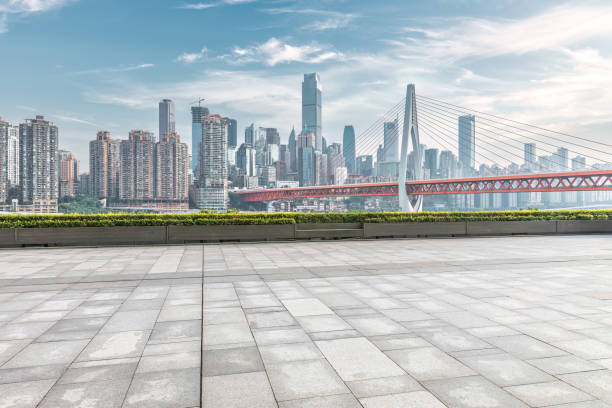 istock Empty square pavement and city buildings skyline 1499184275