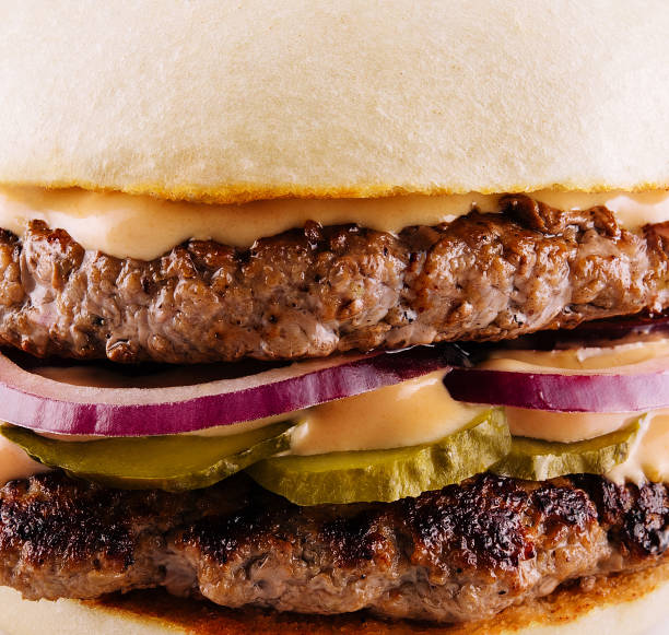 istock hamburger with two cutlets, pickled cucumbers and melted cheese 1499184298