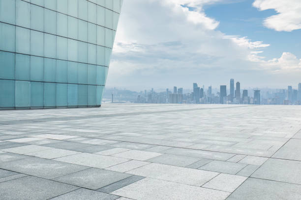 istock Empty square pavement and city buildings skyline 1499184343
