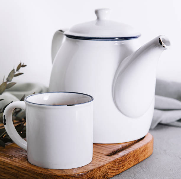 istock vintage metal teapot and mug with tea 1499184392