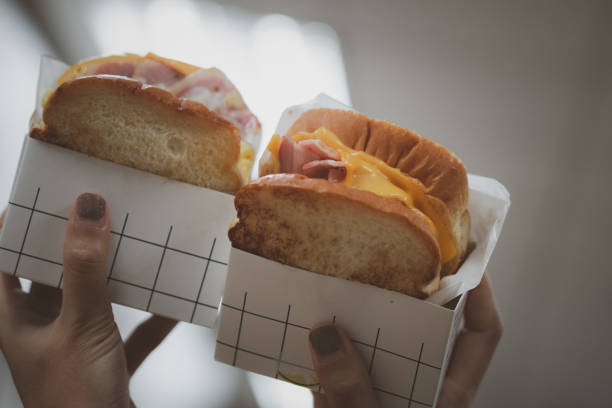 istock Two of Korean egg drop sandwich or scrambled egg sandwich on woman hand 1499185441