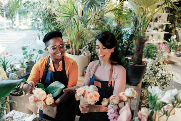 istock Female Worker Making Bouquet in Flower Shop 1499185507