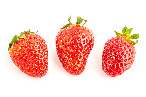 Three fresh strawberry fruits isolated on white background isolate
