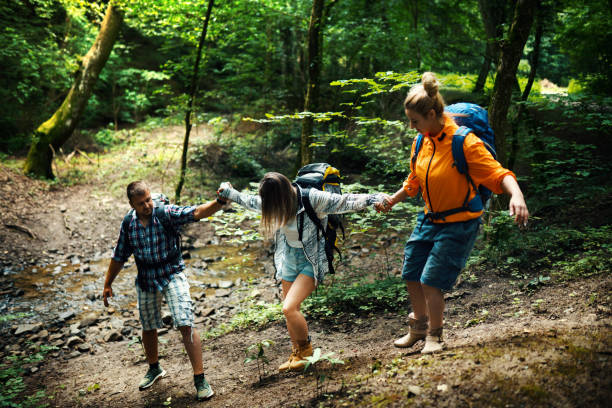 istock Friends hiking through woods. 1499187368