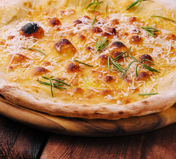 istock Board with tasty pizza on wooden background 1499189315