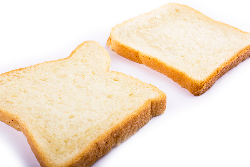two slices of bread for toast on a white background