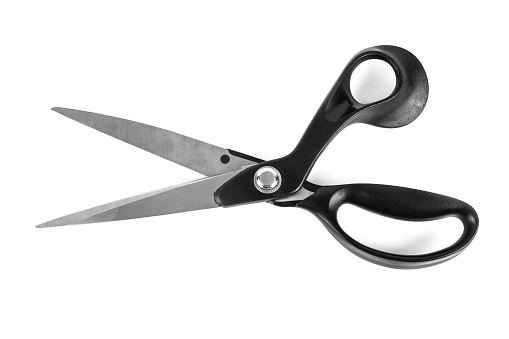 Pair of tailor scissors with black handle isolated on white background