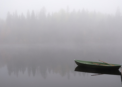 Finland lake forest wilderness fishing boat autumn fog