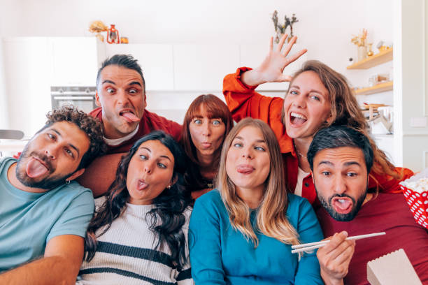 istock group of friends students making crazy faces together for a selfie 1499209224