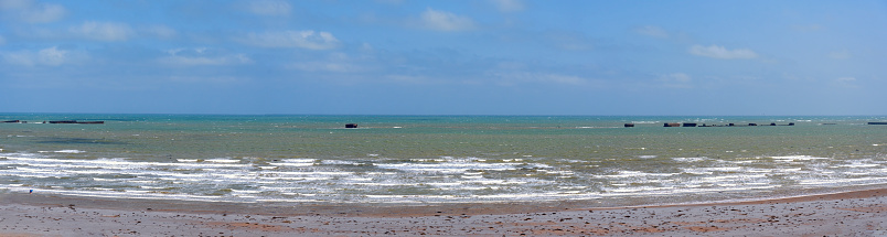 panoramic view across the beach of Arromanches le Bains in the Normandy where on D-Day the invasion happened, France