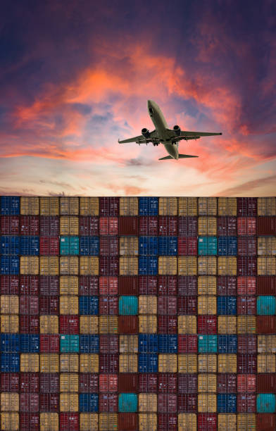 istock Airplane flying above container port. 1499212553
