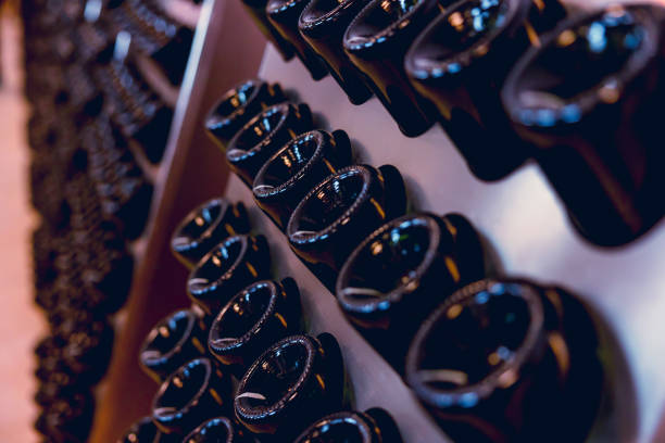 istock Wine making bottle resting for second fermentation Riddling Disgorging process in wine factory. 1499212734