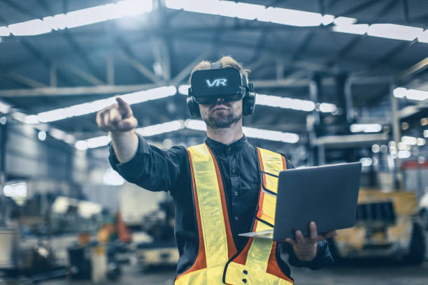 istock Engineer male using VR virtual reality technology in modern warehouse factory new innovation engineering 1499212757