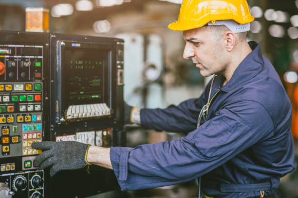 istock Caucasian Engineer Male Skill Worker Working Operate CNC Lathe Machine In Metal Factory. 1499212820