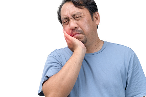 Handsome middle age senior man wearing blue shirt  touching mouth with hand with painful expression because of toothache or dental illness on teeth. Dentist concept.