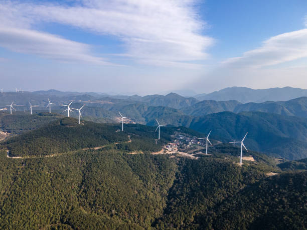 istock Wind turbines on the mountaintop of a sunny day 1499214902