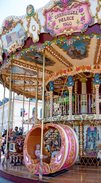 colorful merry-go-round in Honfleur traditional colorful merry-go-round at the village Honfleur in the Normandy at Marine day (Fête des Marins) on Pentecost , France whitsun stock pictures, royalty-free photos & images