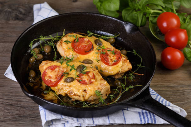 istock Chicken breast with cheese and tomatoes 1499219276