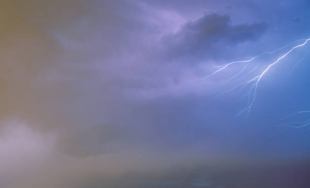 istock Lightning illuminating the overcast sky. 1499220336